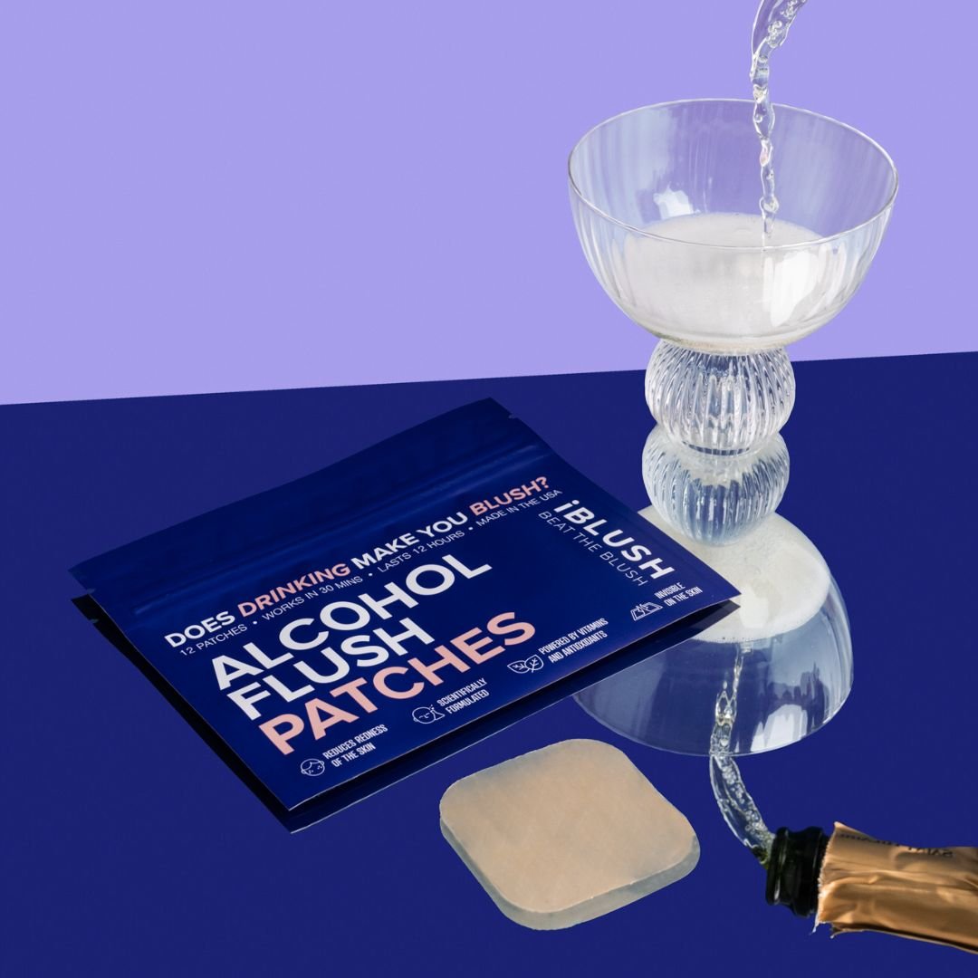 Asian flush patches with a glass of alcohol on a reflective surface