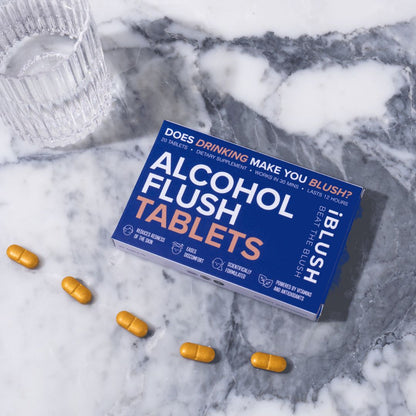 Box of Alcohol Flush Tablets on a marble surface with the alcohol flush pills around