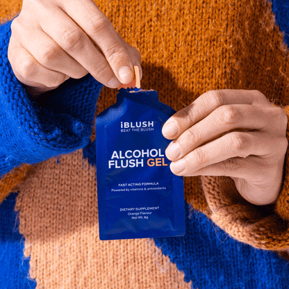 Hands opening iBlush Alcohol Flush Gel sachet, orange-flavoured fast-acting supplement for Asian flush relief